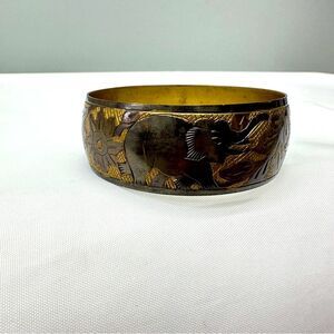elephant bangle. pattern repeated 3 times around band. 2.75 inch diameter